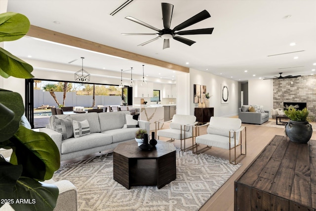 5919 N 45th St, Phoenix, AZ 85018 - living area featuring ceiling fan, light wood-type flooring, a fireplace, and recessed lighting