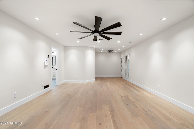 unfurnished room with ceiling fan and light hardwood / wood-style floors