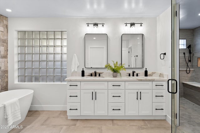 5919 N 45th St, Phoenix, AZ 85018 - bathroom featuring double vanity, a soaking tub, a stall shower, and plenty of natural light