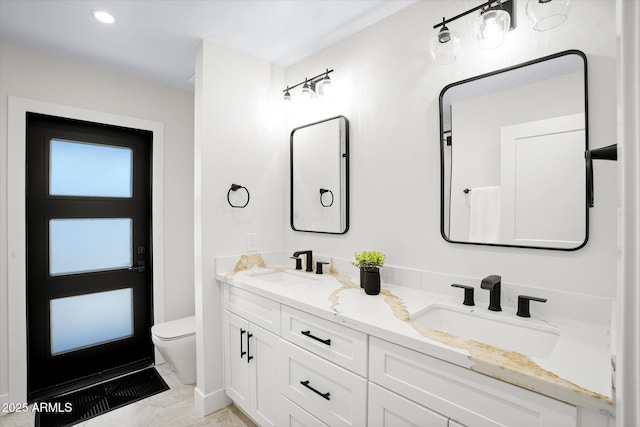 5919 N 45th St, Phoenix, AZ 85018 - bathroom featuring double vanity, marble look tile flooring, and recessed lighting