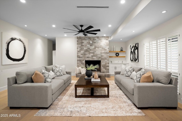 5919 N 45th St, Phoenix, AZ 85018 - living area with recessed lighting, wood finished floors, a large fireplace, and a ceiling fan
