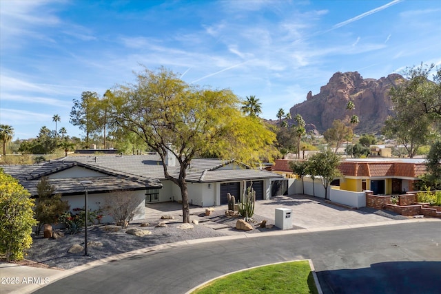 5919 N 45th St, Phoenix, AZ 85018 - single story home featuring an attached garage, driveway, a mountain view, stucco siding, and a tile roof