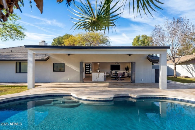 view of swimming pool with a patio area