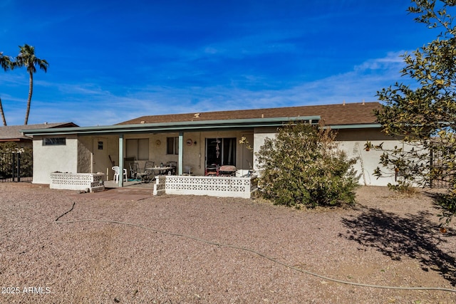 back of property with a patio area