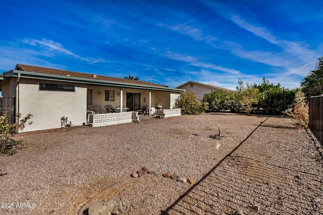 back of property with a patio area