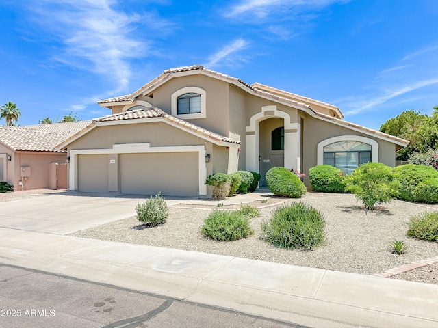 3921 W Jasper Dr, Chandler, AZ 85226 - mediterranean / spanish house with concrete driveway, stucco siding, a tiled roof, and a garage