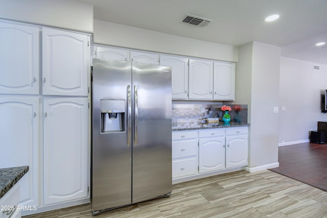 3921 W Jasper Dr, Chandler, AZ 85226 - kitchen featuring stainless steel fridge with ice dispenser, white cabinets, backsplash, dark stone counters, and recessed lighting