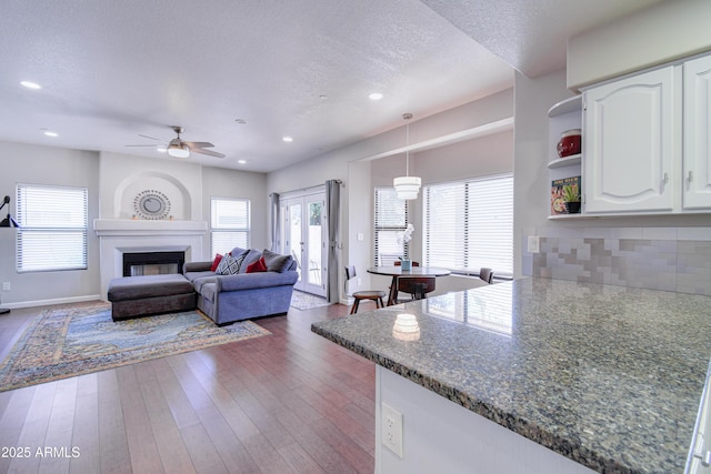 3921 W Jasper Dr, Chandler, AZ 85226 - living area with a ceiling fan, plenty of natural light, a textured ceiling, dark wood finished floors, and recessed lighting