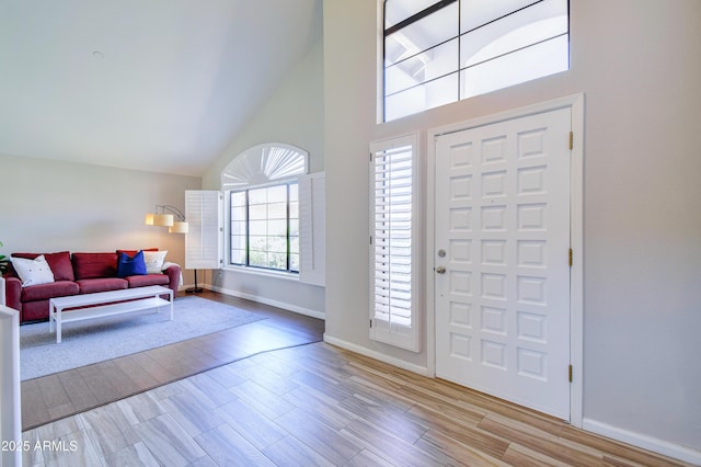 3921 W Jasper Dr, Chandler, AZ 85226 - foyer featuring high vaulted ceiling, baseboards, and wood finished floors