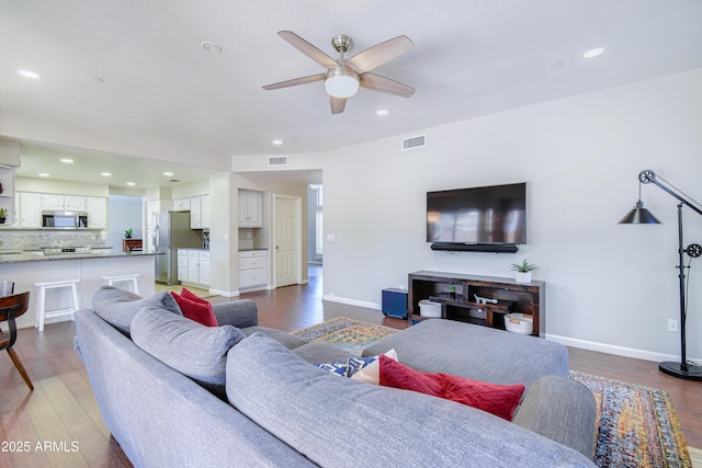 3921 W Jasper Dr, Chandler, AZ 85226 - living room featuring a ceiling fan, wood finished floors, recessed lighting, and baseboards