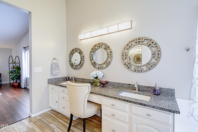 3921 W Jasper Dr, Chandler, AZ 85226 - full bathroom featuring double vanity, wood finished floors, and baseboards