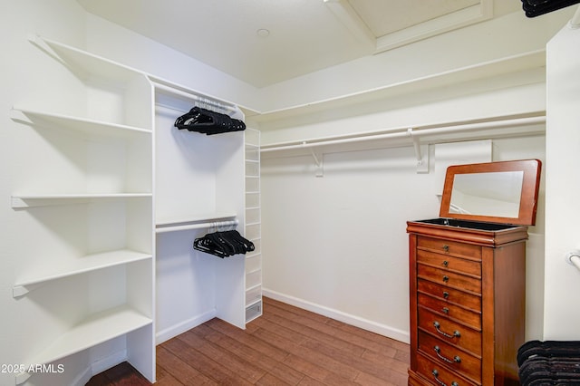 3921 W Jasper Dr, Chandler, AZ 85226 - walk in closet featuring wood finished floors and attic access