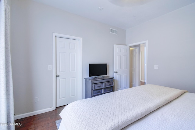 3921 W Jasper Dr, Chandler, AZ 85226 - bedroom featuring dark wood-style flooring and baseboards
