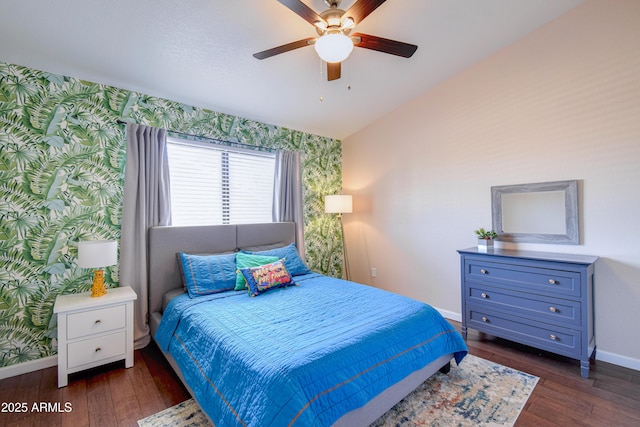 3921 W Jasper Dr, Chandler, AZ 85226 - bedroom featuring wallpapered walls, baseboards, an accent wall, dark wood-type flooring, and ceiling fan
