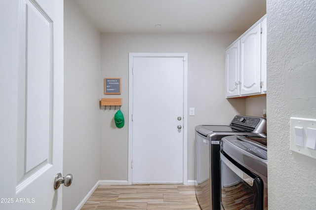 3921 W Jasper Dr, Chandler, AZ 85226 - laundry room featuring separate washer and dryer, cabinet space, light wood-style flooring, and baseboards