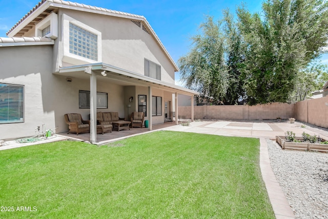 3921 W Jasper Dr, Chandler, AZ 85226 - rear view of property with an outdoor living space, a patio area, stucco siding, and a vegetable garden