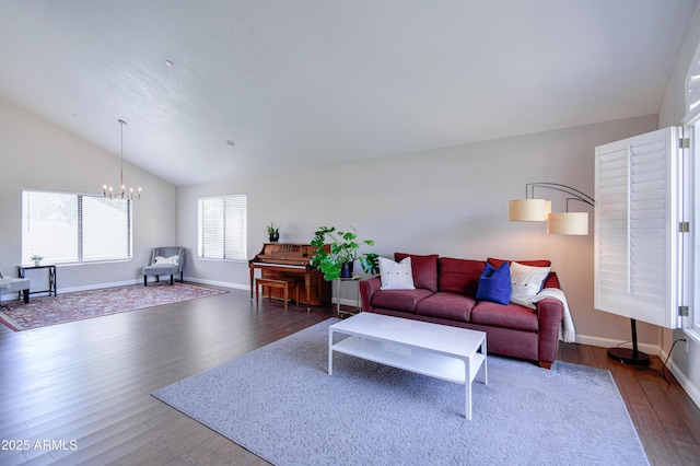 3921 W Jasper Dr, Chandler, AZ 85226 - living room with a chandelier, dark wood-style flooring, vaulted ceiling, and baseboards