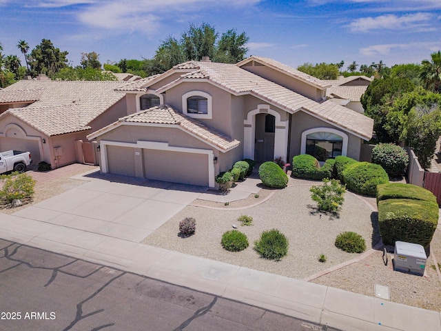 3921 W Jasper Dr, Chandler, AZ 85226 - mediterranean / spanish home with stucco siding, a tiled roof, an attached garage, and concrete driveway