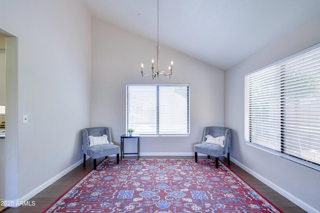 3921 W Jasper Dr, Chandler, AZ 85226 - living area featuring a chandelier, lofted ceiling, wood finished floors, and baseboards