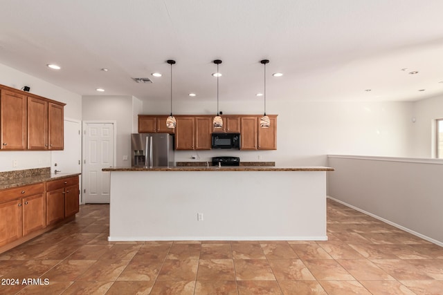 kitchen with visible vents, brown cabinetry, a kitchen island, black appliances, and recessed lighting