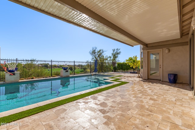 view of swimming pool featuring a patio area, a fenced backyard, and a fenced in pool