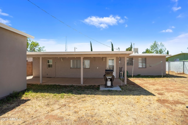 301 Whitton St, Sierra Vista, AZ 85635 - rear view of property featuring stucco siding, fence, and a patio area