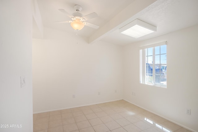 301 Whitton St, Sierra Vista, AZ 85635 - empty room with ceiling fan, baseboards, beamed ceiling, and light tile patterned floors