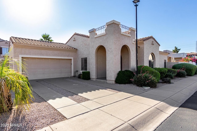 16846 N 49th Way, Scottsdale, AZ 85254 - mediterranean / spanish-style house with a tile roof, driveway, stucco siding, and a garage
