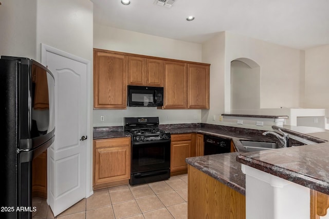 16846 N 49th Way, Scottsdale, AZ 85254 - kitchen with black appliances, a sink, light tile patterned flooring, a peninsula, and recessed lighting