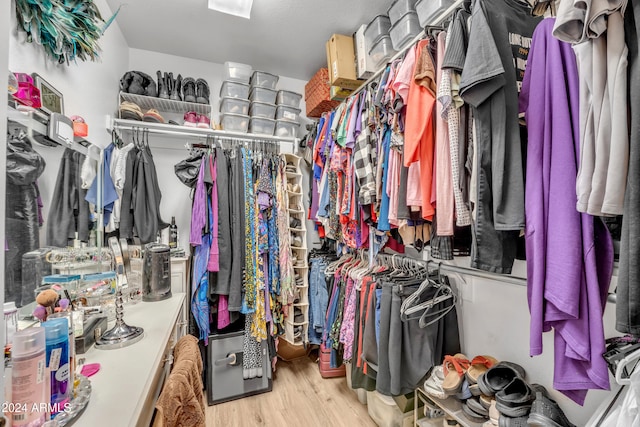 spacious closet with light hardwood / wood-style floors