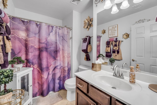 bathroom featuring tile patterned floors, vanity, and toilet