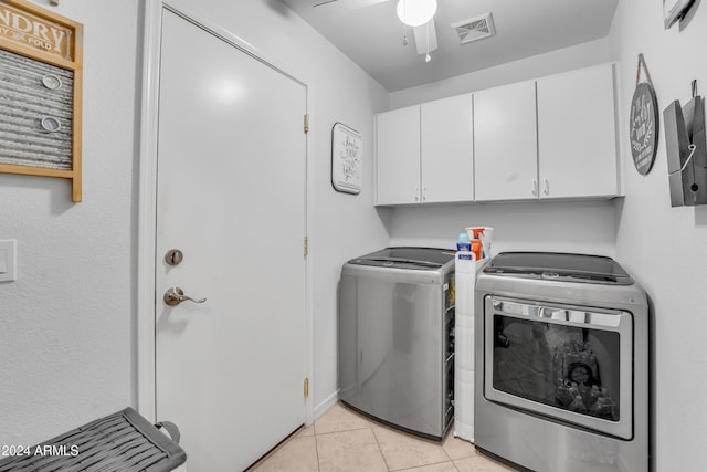 laundry room featuring washer and clothes dryer, ceiling fan, light tile patterned flooring, and cabinets