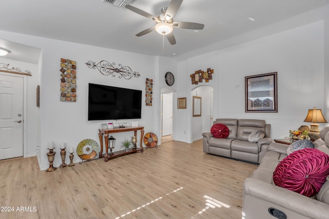 living room featuring hardwood / wood-style flooring and ceiling fan