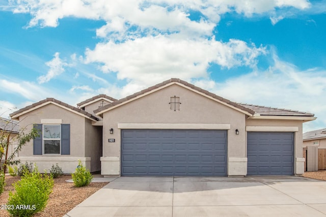 ranch-style home featuring a garage