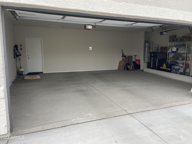 garage with a garage door opener and water heater