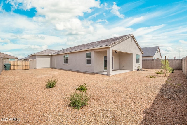 back of house with a patio area