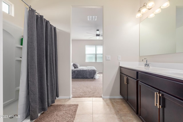 bathroom with ceiling fan, vanity, and tile patterned flooring