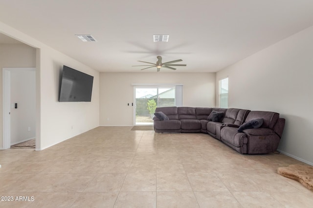 living room with light tile patterned flooring and ceiling fan