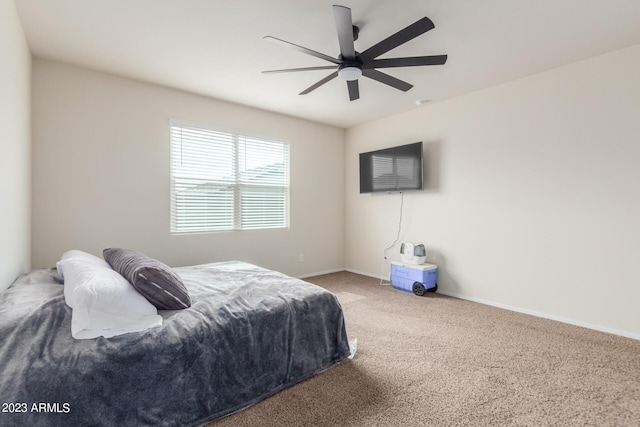 bedroom with ceiling fan and carpet flooring