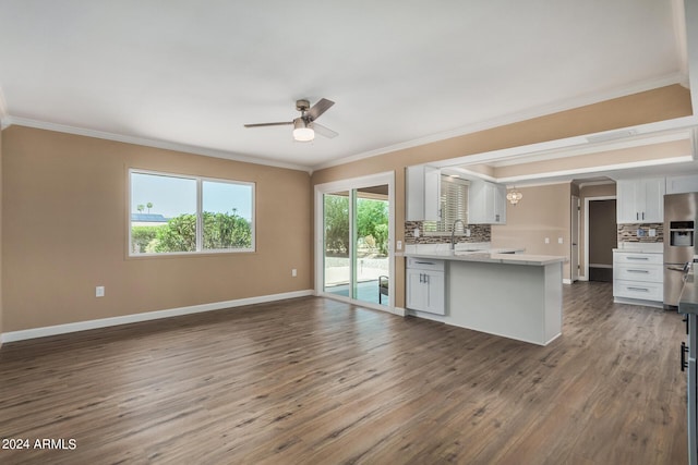 kitchen featuring stainless steel refrigerator with ice dispenser, dark hardwood / wood-style floors, white cabinets, and backsplash