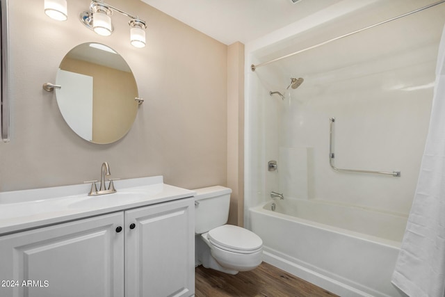 full bathroom featuring vanity, wood-type flooring, shower / bath combo, and toilet