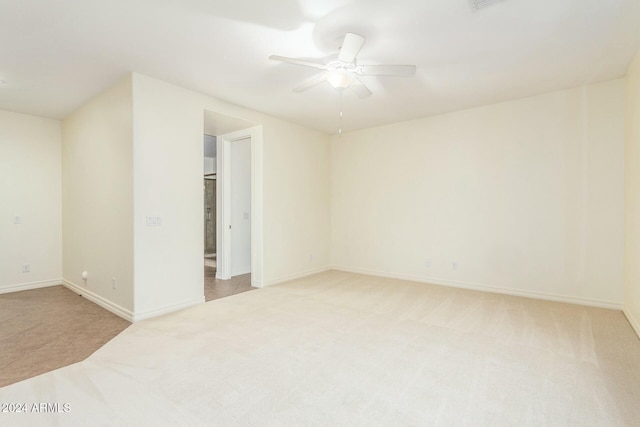 carpeted empty room with ceiling fan