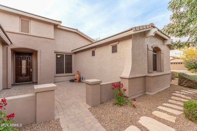 view of side of property with a patio