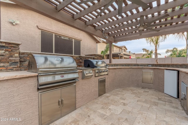 view of patio / terrace with area for grilling, a pergola, and grilling area