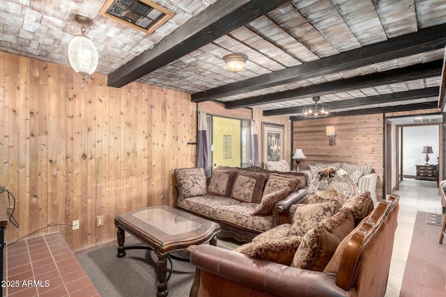 living room with beamed ceiling and wood walls