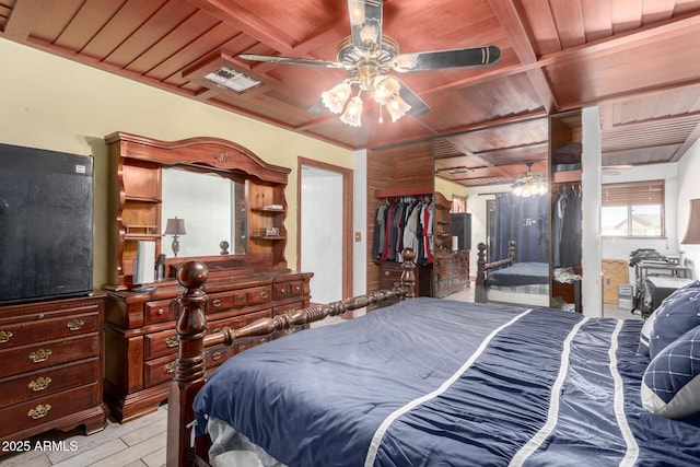 bedroom with coffered ceiling, wooden ceiling, and light wood-type flooring