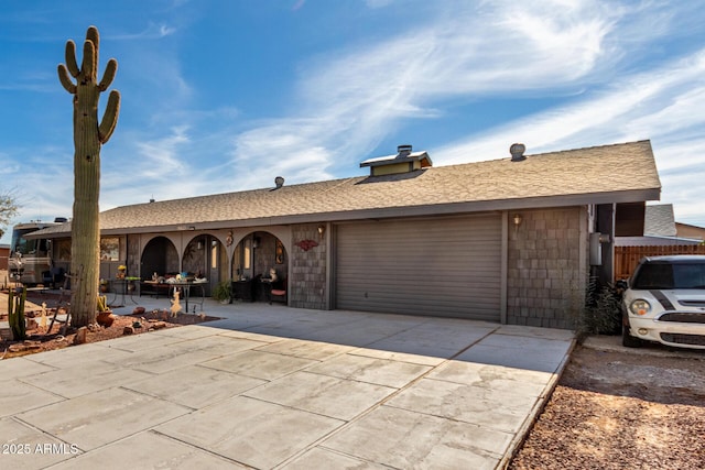 single story home featuring a garage