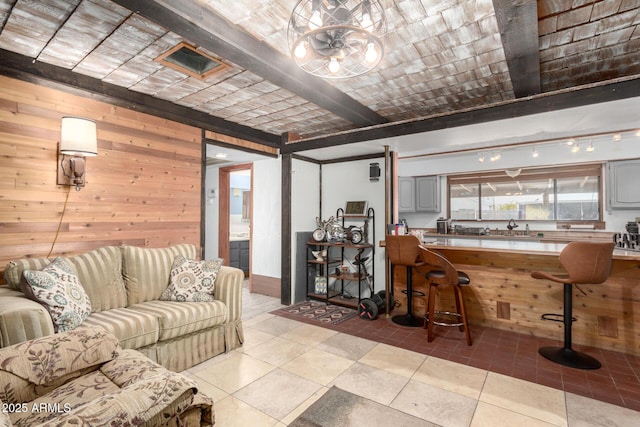 tiled living room with sink, wooden walls, and brick ceiling