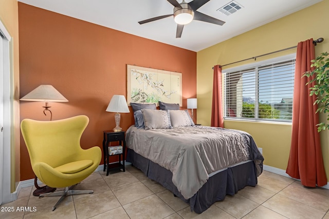 tiled bedroom with ceiling fan