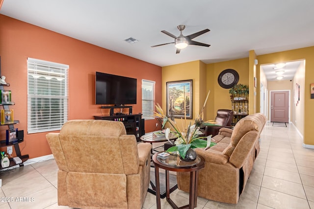 living room featuring ceiling fan and light tile patterned floors